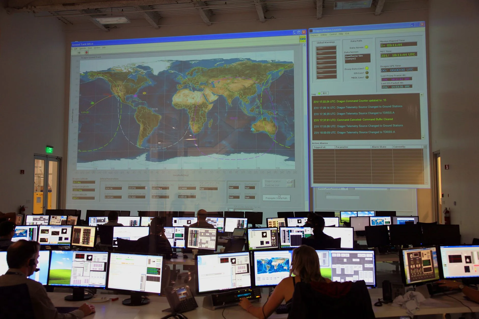 Server room with LED lights, computers, and cables, illustrating desktop database management system security.