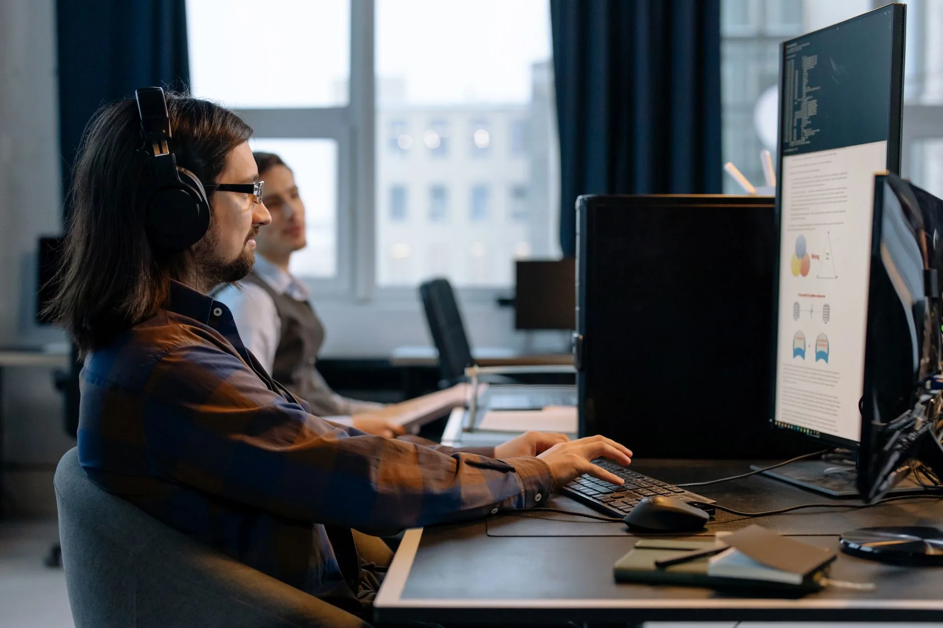 Cybersecurity operations center with monitors, dimly lit, Human-in-the-Loop Validation for Cloud Security Alerts.